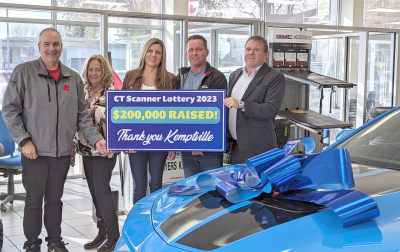 (l-r) Pat Poirier, KDH Foundation Director and Joanne Mavis, Foundation, Executive Director, hold the thank you sign with Bob McVeigh, Myers General Manager, Kemptville (far right). Centre, happy winners of the Grand Prize blue Camaro, Mandy Moodie and Todd Durie. Todd Durie, (middle) winner of the CT Scanner Lottery Grand Prize, Camaro, is seen here with his partner Mandy, Foundation Executive Director, Joanne Mavis (far left),