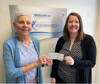 Jeanne Lambert from Bishop’s Mills Women Involved, presents a cheque from the women’s group for the CT Scanner Crossroads Campaign, to Kristy Carriere, KDH Foundation Coordinator.