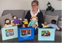 Petra McElrea, seen here surrounded by her hand-knitted dolls and books, donated the proceeds of her recent sales to the KDH Foundation CT Scanner Crossroads Campaign.